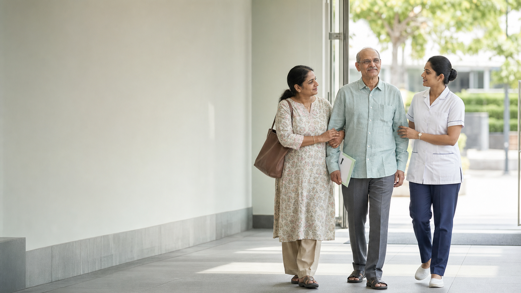 An older patient walking out of hospital with a family caregiver and nurse
